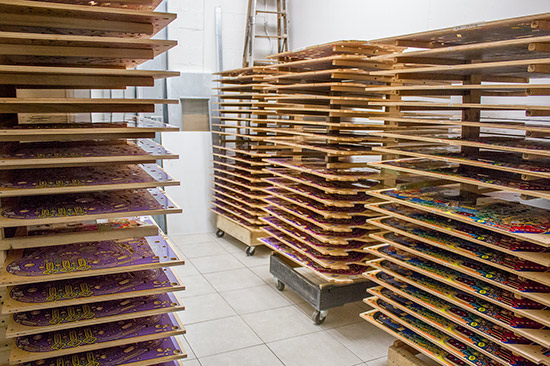 Clearcoated playfields drying in racks