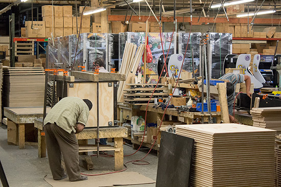 Building video cabinets with The Wizard of Oz pinball cabinets in the back
