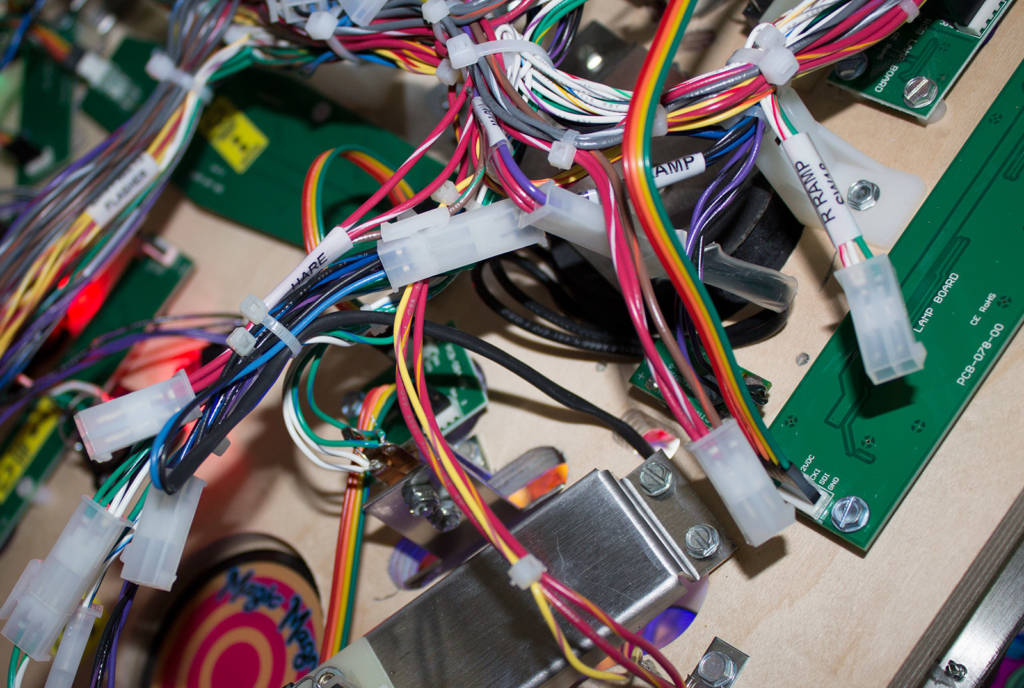 Some of the many unconnected cables under the playfield