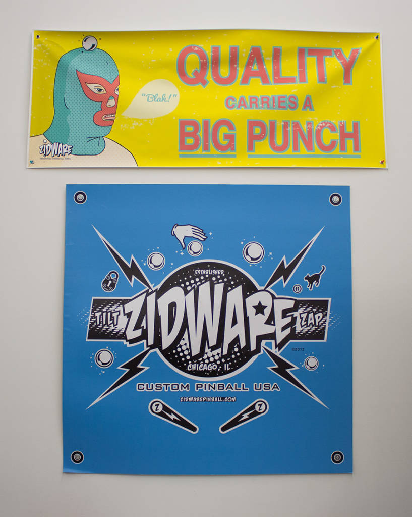 Two of the signs on the wall of John's studio