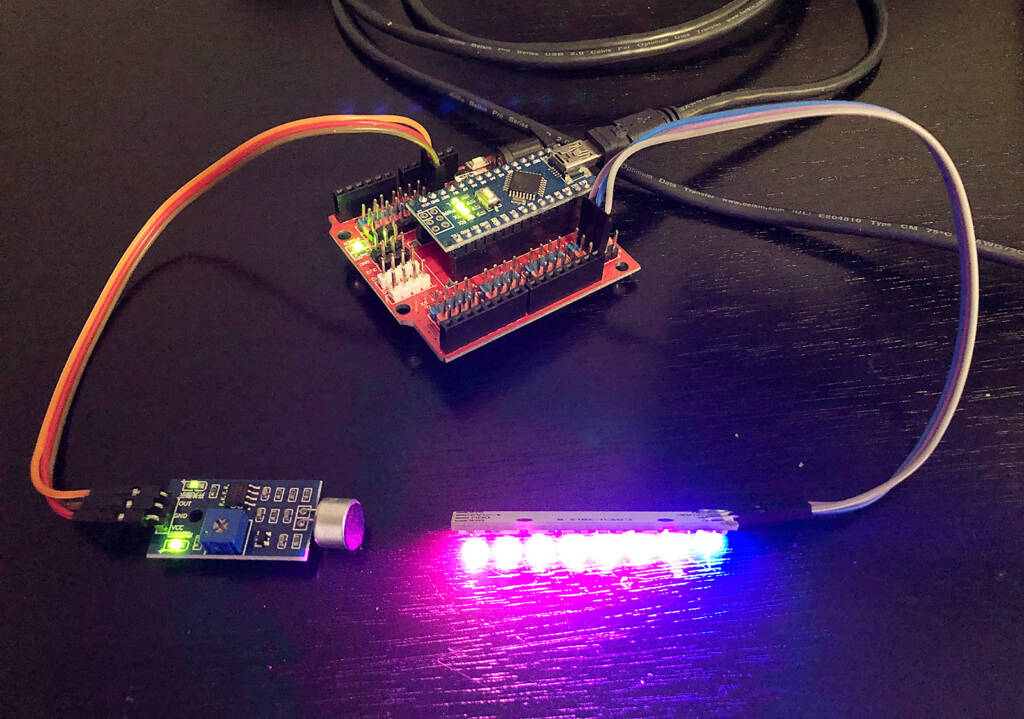 A microphone module is the input, a NeoPixel stick is the output