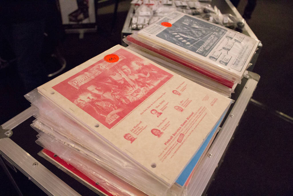 A stack of game manuals you could buy at the Pinball Universe stand