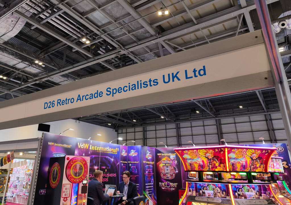 Retro Arcade Specialists' name on the inside of the marquee of an empty stand