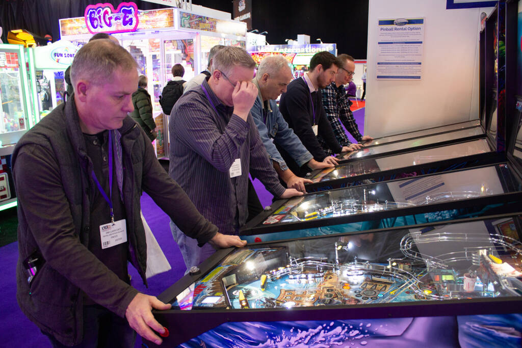 Players on the five Stern Pinball games