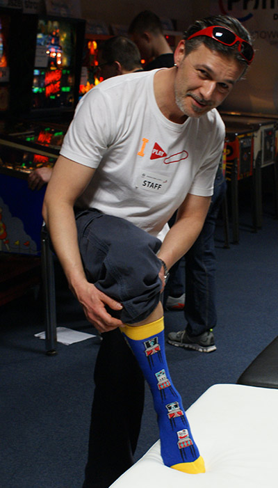 Łukasz shows off his pinball socks