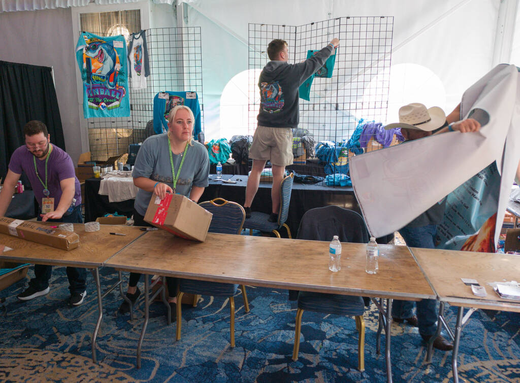 Packing away the show merchandise stand