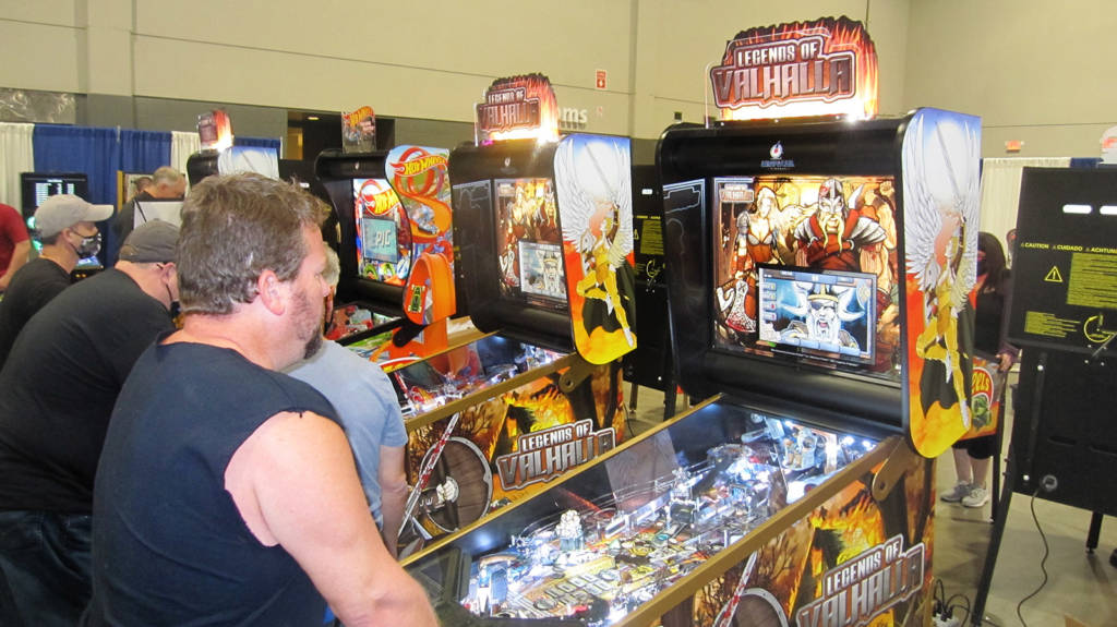 Two of the Legends of Valhalla machines on the American Pinball stand