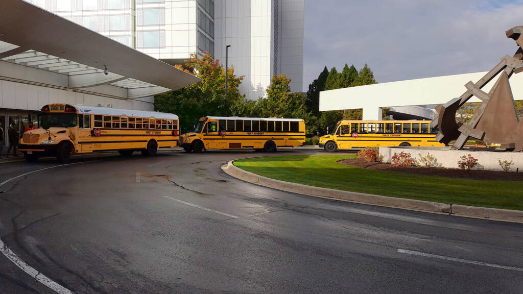 The buses taking guests to the Stern Pinball factory tour