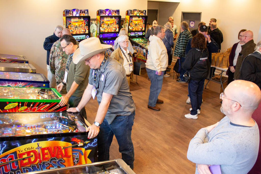 Tour guests enjoy the Chicago Gaming machines at the factory