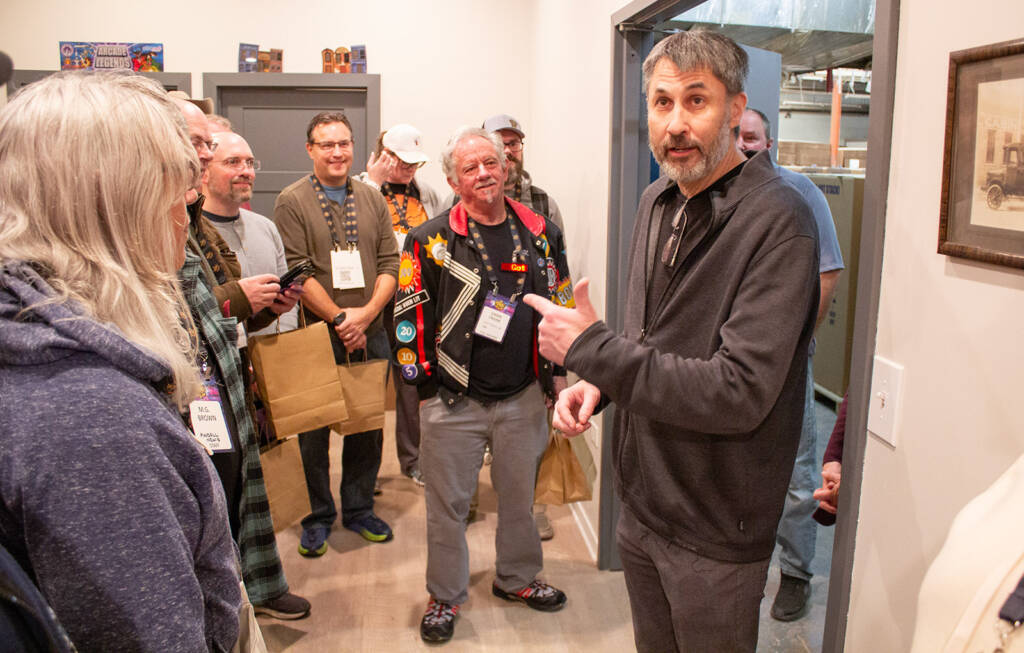 Doug Duba welcomes Pinball Expo tour guests to his factory