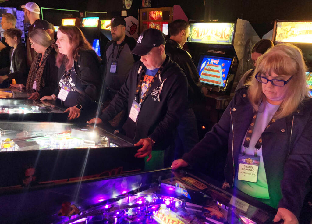 Pinball Expo tour guests enjoying the games