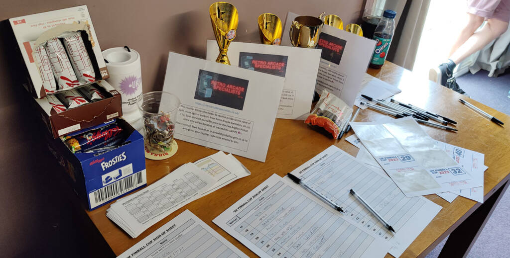 The registration desk with trophies and prizes for the top four