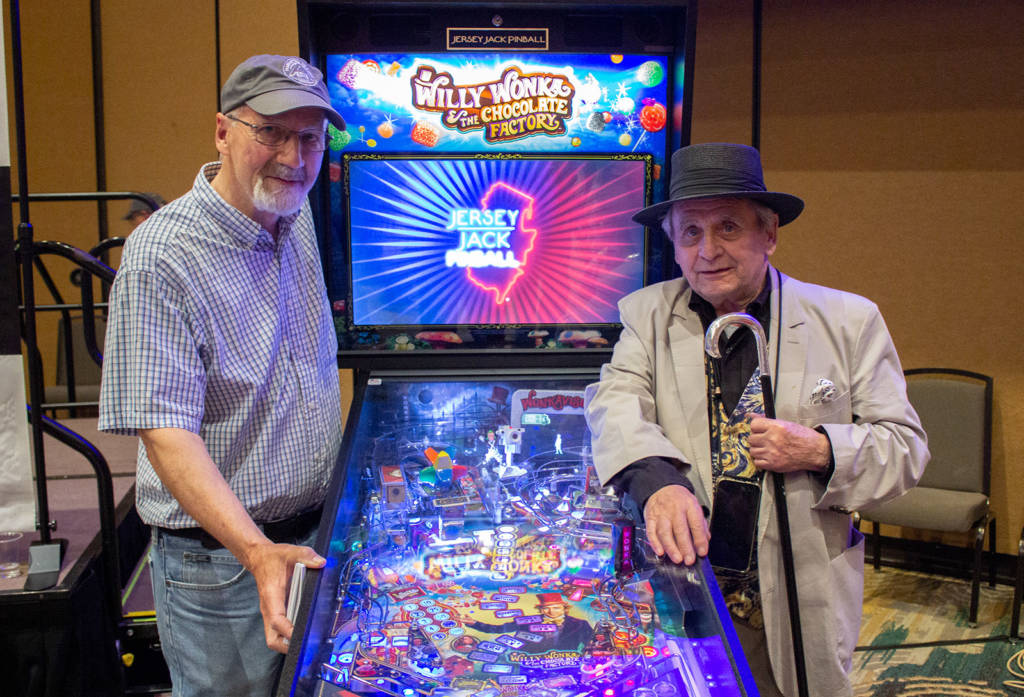 Gary Walters with Sylvester McCoy and the raffle prize of a new Willy Wonka game
