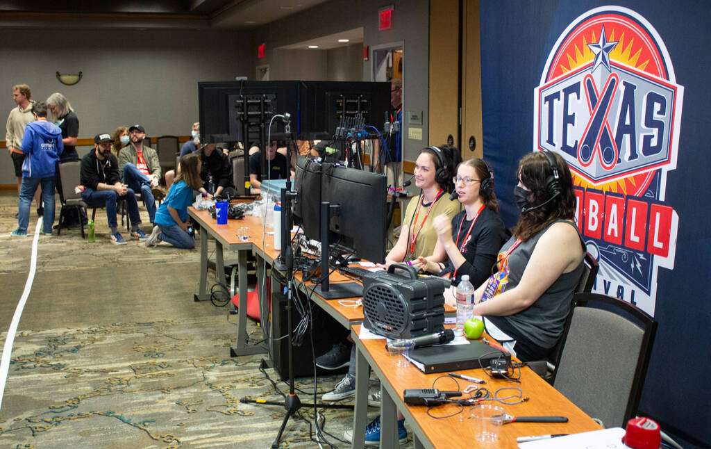 The commentary team and audience for the Texas Takedown Tournament