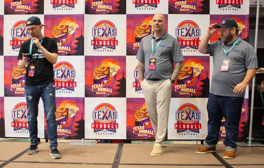 Nate, Melvin and Ron from American Pinball as the winner's name is announced
