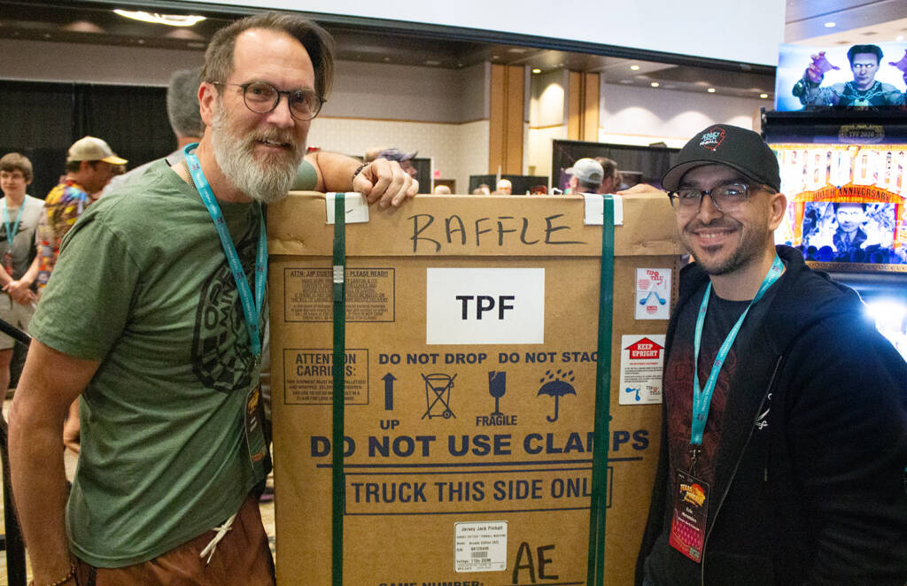 Grand prize winner, Adam Breakey with game designer Eric Meunier