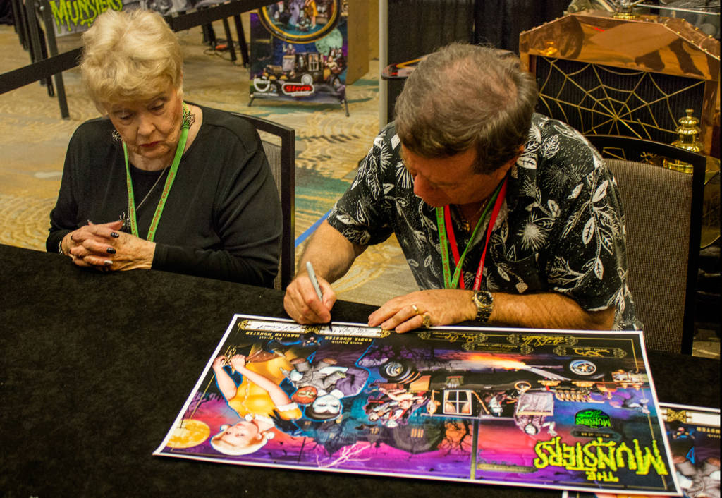 Pat Priest and Butch Patrick signing posters