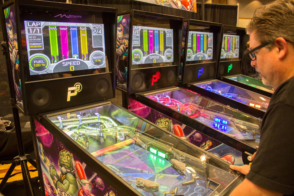 Multimorphic had a large display featuring four linked P3 machines playing Cosmic Cart Racing