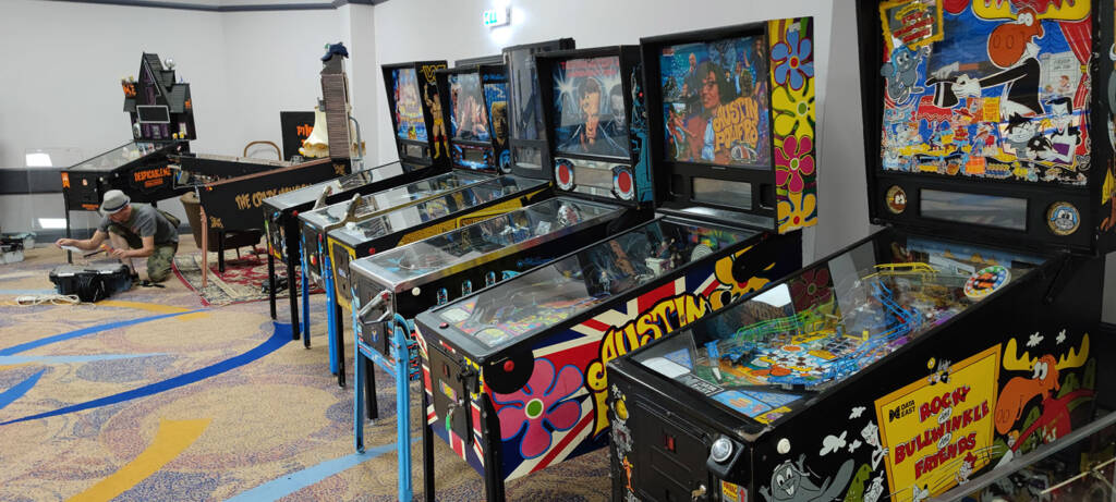 The front row of machines including the games from the Pinball Amigos