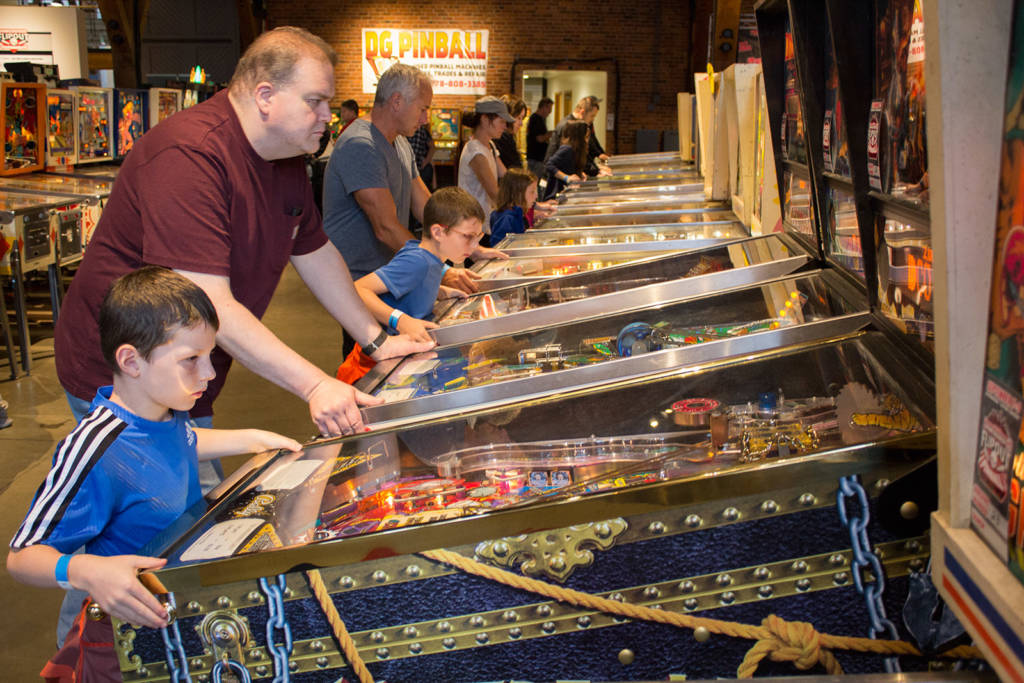 Lots of youngsters were playing both on the pinballs...