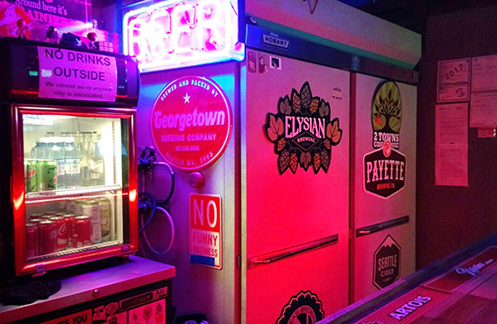 The refrigerators next to the bar