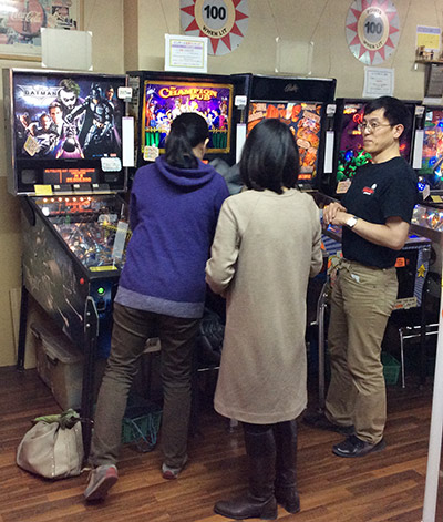 Mr Horiguchi introduces some ladies to pinball